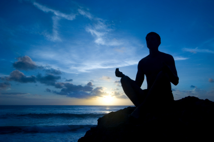 man_meditating_water